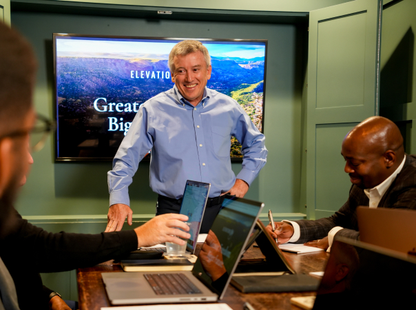 Jerry presenting at the front of a room.