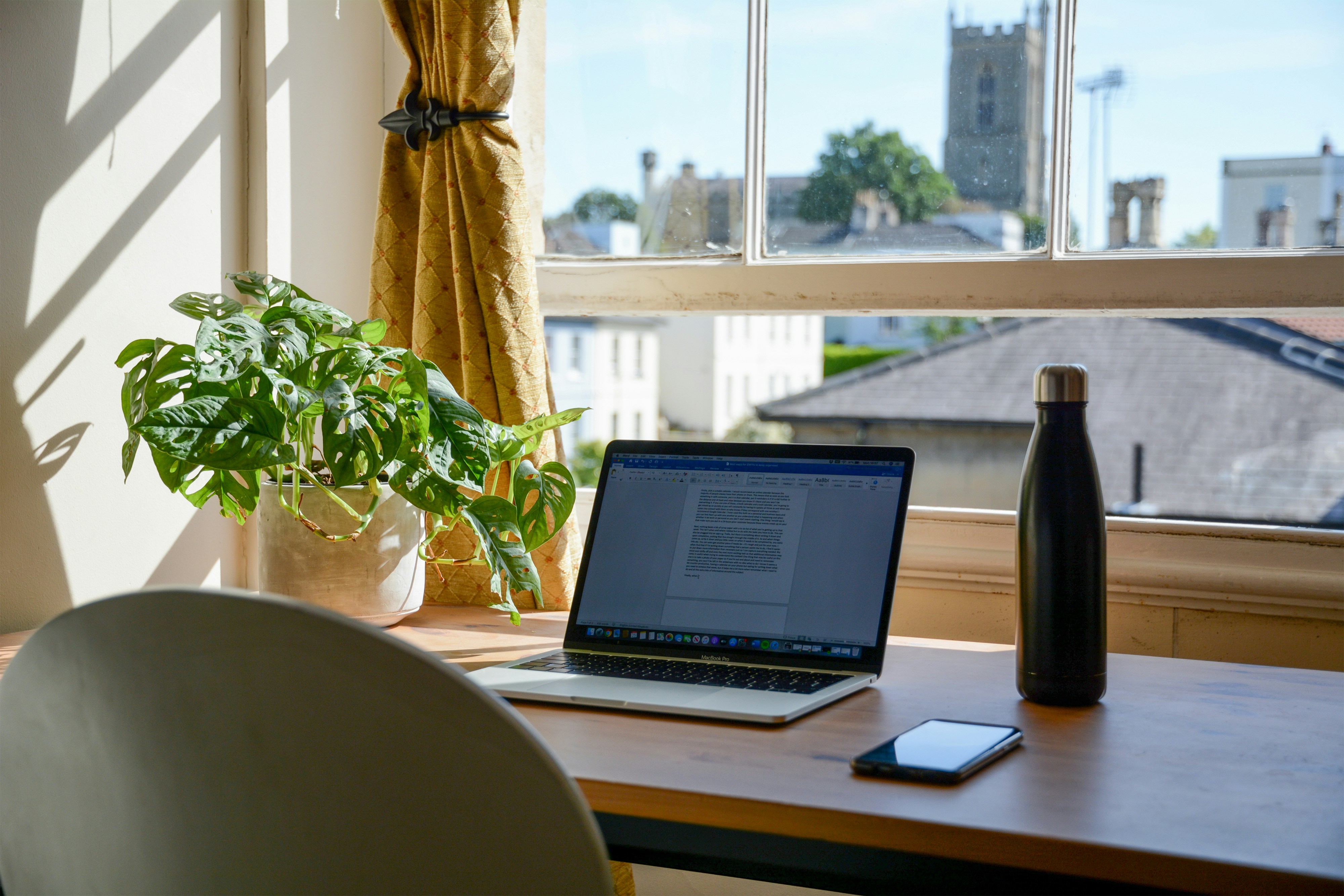 Work from home office setup overlooking the city